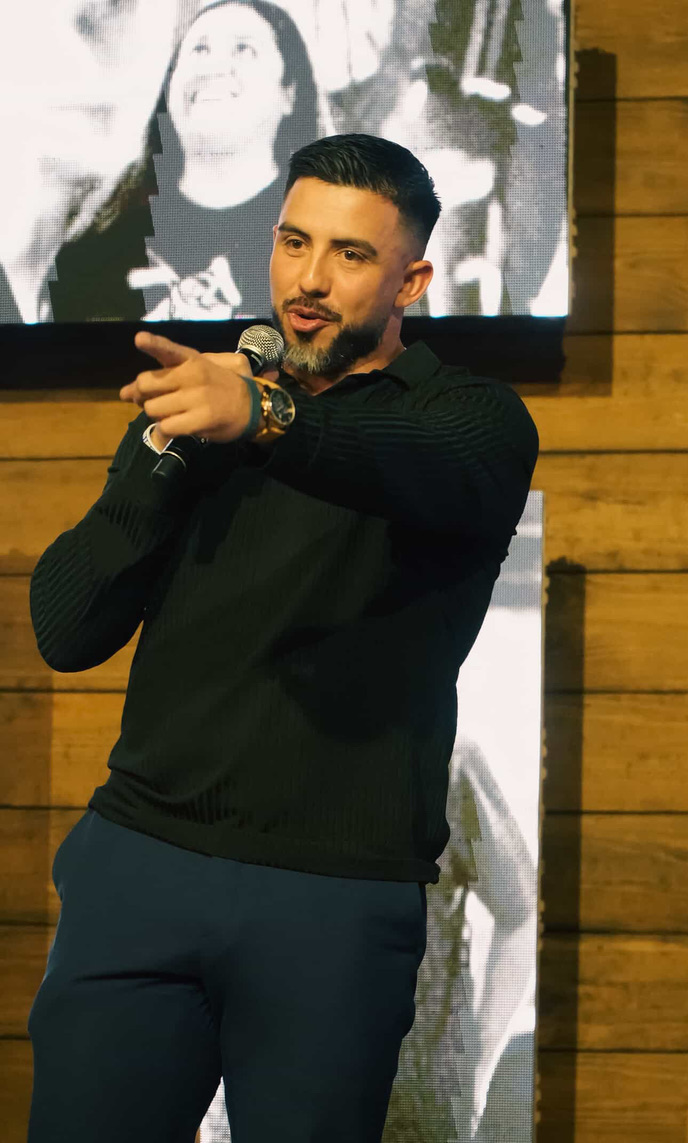 Luis Hernandez speaking at a professional event