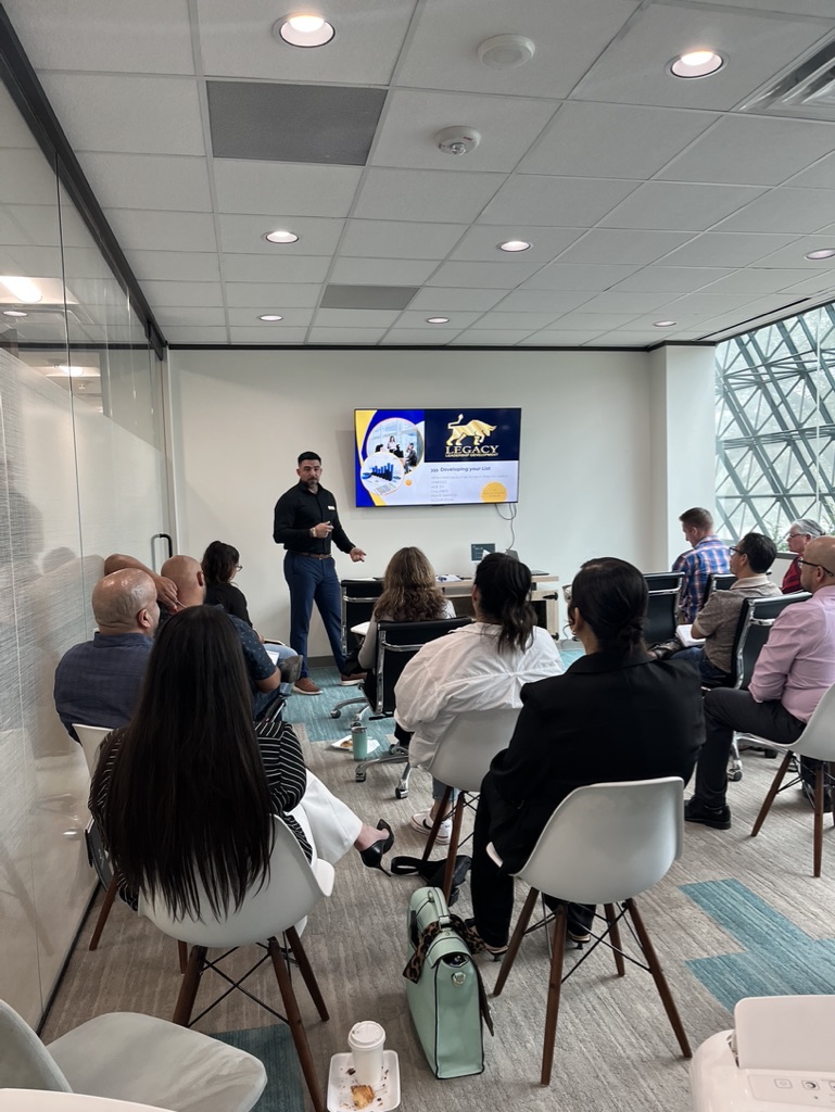 Luis Hernandez presenting financial education to a group